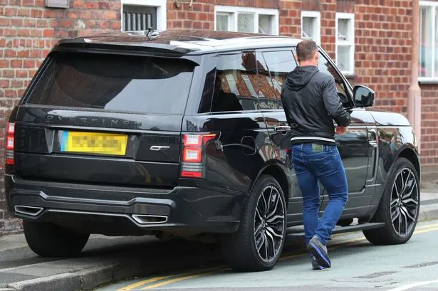 PAY-Wayne-Rooney-leaves-Range-Rover-on-the-pavement-in-Wilmslow (1)