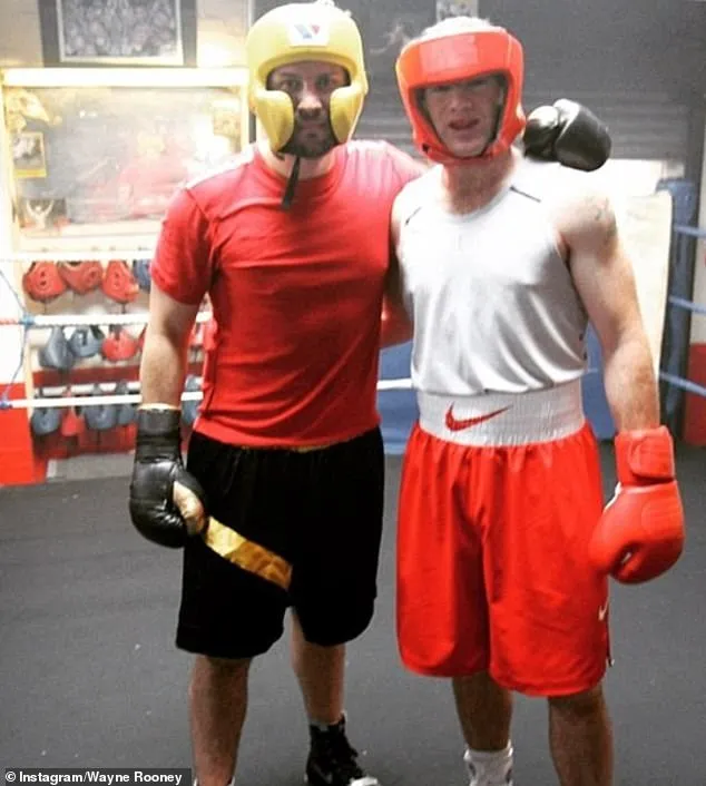 'Boxing is the sport I like watching most': Despite failing to showcase his boxing skills during the friendly match, the footballer detailed his close relationship with the sport (pictured with professional boxer Paul Smith)