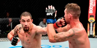 Robert Whittaker (trái) muốn trở lại lồng bát giác vào tháng 10 tới.