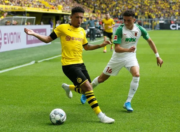 Jadon Sancho seals bumper new £190,000-a-week contract at Borussia Dortmund with Manchester City and Manchester United circling - Bóng Đá